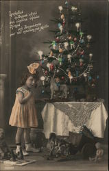 Little Girl in front of Christmas Tree Postcard