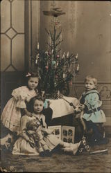 Young Children in front of Christmas Tree Postcard Postcard