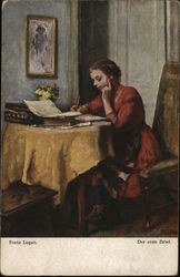 Girl Wearing Orange Dress Seated at Table Writing Postcard