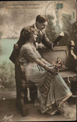 Man Reading to Woman Postcard