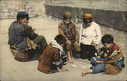 Man Seated on Basket Near Four Boys Playing Cards Postcard