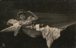 Smiling Woman Holding Parasol Laying in Hammock Women Postcard Postcard