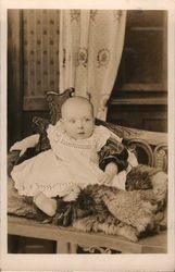 Infant Sitting on Fur Postcard