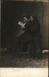 Snapshot of Two Women Reading Postcard Postcard Postcard