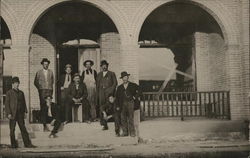 Men in Front of Building Postcard