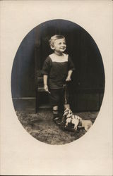 Snapshot of Boy With Pull Toy Postcard