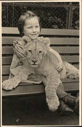 Girl with Lion Cub in Lap Lions Postcard Postcard