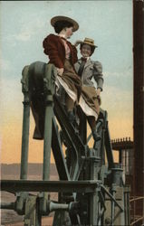 Women sitting on Oil Pump Postcard