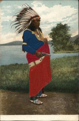 Native American man with headdress and gun Postcard