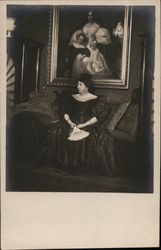 Woman Holding Fan Seated in Front of Portrait Postcard