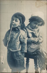 Two Young Children with Long-Stemmed Pipes Postcard