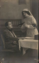 Red Cross Nurse Feeding Injured Soldier Postcard