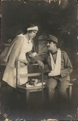 Wounded soldier with nurse Postcard