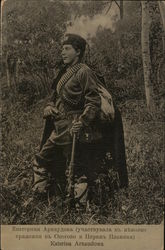 Katerina Arnaudowa - Soldier Holding Rife, Wearing Bullet Belts, Outdoors Near Trees Military Postcard Postcard