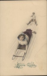 Bonne Annee - Sledding New Year's Postcard Postcard