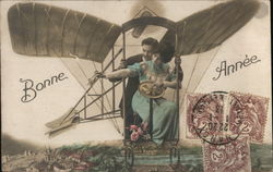 French Couple in a "Flying Machine" Aircraft Postcard Postcard