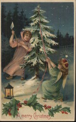 Children chopping down a Christmas tree. Postcard