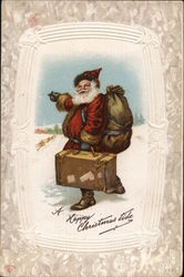 A Happy Christmas Tide - Santa Hitchiking in Snow with Sack and Suitcase Santa Claus Postcard Postcard