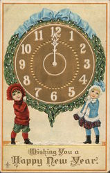 Two children holding up a clock striking midnight. Postcard