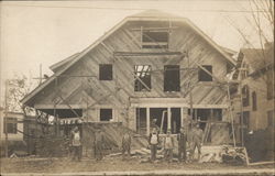 Men Constructing a Large House Postcard