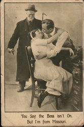 Man Looking on as another man kisses a woman Postcard