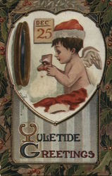 Yultide Greetings with Cherub Dressing as Santa Angels Postcard Postcard