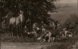 A Short Rest - Hunting party, man, horse, and dogs Postcard Postcard