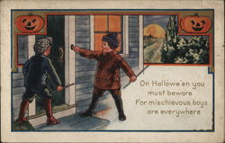 Two Boys at Door on Halloween Postcard Postcard