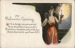 Woman looking in mirror by candlelight Postcard