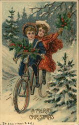 A young girl and boy ride a bicycle through the snow carrying holly branches Children Postcard Postcard