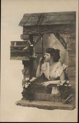 Girl Looking out Window at Birdcage Postcard