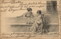 Two beautiful women in white sitting on marble. Postcard