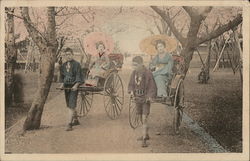 Japanese women being pulled in rickshaws Postcard