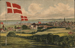 A Danish town with flags Postcard