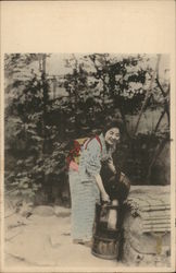 Japanese woman getting water Postcard Postcard