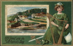 Woman in a green dress sits behind a harp. Scenic picture of homes on a hillside and river. Postcard