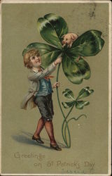 A nicely dressed boy sees a pig sitting atop a giant clover. Postcard