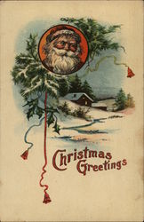 Christmas Greetings. Santa's face above a snow-capped cabin. Santa Claus Postcard Postcard Postcard