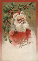 Wishing You a Merry Christmas. Picture of Santa's bust with holly and ivy above. Postcard