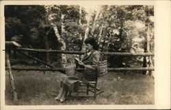 Girl Sitting Outside in Rocking Chair Postcard