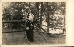 Man in Indian Garb and Rifle Postcard