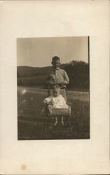 Boy and Baby in Carriage Postcard