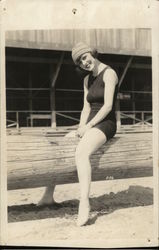 Girl in Bathing Suit Sitting on Log Postcard