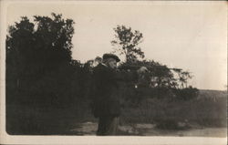 Man Shooting Gun Postcard