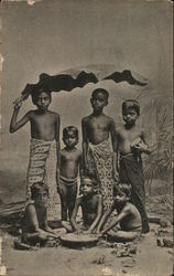 Group of children under banana leaf Postcard