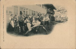 Men wrestling in front of onlookers Postcard