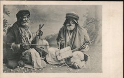 Two old men playing Cigar Box Instruments Postcard