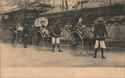 Ladies travelling in hand drawn carts, Rickshaws Postcard