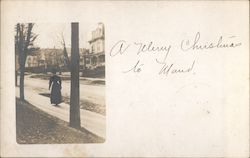 Woman Walking Down Street Postcard