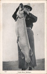 Man Holding Large Fish Cedar River, MI Postcard Postcard Postcard